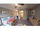 Spacious bedroom featuring a neutral color palette, plush carpet, and a walk-in closet for ample storage at 7504 Lily Pad Ct, Hudson, FL 34667