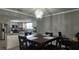 Cozy dining area with modern chandelier lighting and views of the stainless steel kitchen appliances at 7504 Lily Pad Ct, Hudson, FL 34667