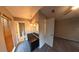 Hallway leading to a full bathroom with a vanity area and a separate door to a bedroom at 7504 Lily Pad Ct, Hudson, FL 34667