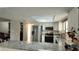 Bright kitchen with white cabinetry, stainless steel appliances, and granite countertops at 7504 Lily Pad Ct, Hudson, FL 34667