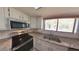 Stainless steel appliances, granite countertops, and white cabinets in bright kitchen at 7504 Lily Pad Ct, Hudson, FL 34667