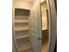 Organized pantry with multiple shelves and wire racks for efficient storage inside of the house at 7504 Lily Pad Ct, Hudson, FL 34667