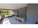 Enclosed patio with hot tub, table with chairs and view to back yard at 7504 Lily Pad Ct, Hudson, FL 34667