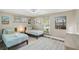 Inviting bedroom features two twin beds and stylish décor with lots of natural light at 7553 Sequoia Dr, New Port Richey, FL 34653
