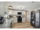 Updated kitchen with stainless steel appliances and granite countertops at 7553 Sequoia Dr, New Port Richey, FL 34653