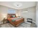 This spacious main bedroom features a large window and plenty of closet space at 7553 Sequoia Dr, New Port Richey, FL 34653