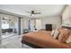 Main bedroom has a sliding door to the screened patio and an ensuite bathroom at 7553 Sequoia Dr, New Port Richey, FL 34653