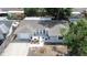 Aerial view of a neatly maintained home with an attached garage and landscaped front yard in a suburban neighborhood at 7830 Judith Cres, Port Richey, FL 34668