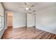 Bright bedroom featuring hard floors and ceiling fan at 7830 Judith Cres, Port Richey, FL 34668