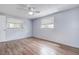 Well-lit bedroom featuring windows and hardwood floors at 7830 Judith Cres, Port Richey, FL 34668