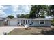 Charming single-story home with a well-manicured front yard, attached garage, and fresh exterior paint at 7830 Judith Cres, Port Richey, FL 34668