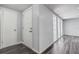 Foyer with freshly painted walls, wood-look floors, and a front door with modern hardware at 7830 Judith Cres, Port Richey, FL 34668