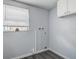 Functional laundry room with updated flooring, utility connections, and a storage cabinet at 7830 Judith Cres, Port Richey, FL 34668