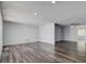 Spacious living room with new wood-look floors, fresh paint, recessed lighting, and a ceiling fan at 7830 Judith Cres, Port Richey, FL 34668