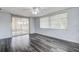 Bright living room featuring hardwood floors and large windows at 7830 Judith Cres, Port Richey, FL 34668