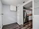 Pantry area leading to kitchen with stainless steel refrigerator at 7830 Judith Cres, Port Richey, FL 34668