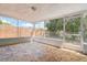 This patio offers screened-in protection and a unique stone tiled floor at 7830 Judith Cres, Port Richey, FL 34668