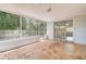 The patio is screen-protected from the elements and features a stone tile floor at 7830 Judith Cres, Port Richey, FL 34668