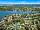 Aerial view of a neighborhood, showing a beautiful home with a pool, landscaping and a waterfront in the distance at 818 37Th Ne Ave, St Petersburg, FL 33704