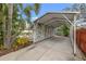 Spacious carport featuring a metal roof and lattice-covered walls for added privacy at 818 37Th Ne Ave, St Petersburg, FL 33704