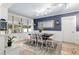 Cozy dining room featuring patterned wallpaper, a dark wood table, and tiled flooring at 818 37Th Ne Ave, St Petersburg, FL 33704