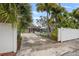 Charming home exterior showcasing a private pool, driveway, and lush tropical surroundings at 818 37Th Ne Ave, St Petersburg, FL 33704