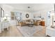 Bright living room featuring a comfortable sectional sofa, stylish decor, and ample natural light at 818 37Th Ne Ave, St Petersburg, FL 33704