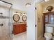 This bathroom has granite counters, dual sinks, a tile shower and is accessible from the bedroom at 8305 Palma Vista Ln, Tampa, FL 33614