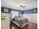 Cozy bedroom with hardwood floors, stylish bedding, and elegant decor at 8305 Palma Vista Ln, Tampa, FL 33614