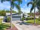Charming single-story home features a well-manicured lawn, beautiful landscaping and a two-car garage at 8305 Palma Vista Ln, Tampa, FL 33614