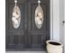 Elegant double front doors with decorative glass inserts and charming floral wreaths at 8305 Palma Vista Ln, Tampa, FL 33614