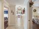 This hallway has access to multiple rooms, and has a decorative light fixture at 8305 Palma Vista Ln, Tampa, FL 33614