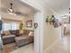 Comfortable living room visible from the hallway, showcasing a sectional sofa at 8305 Palma Vista Ln, Tampa, FL 33614