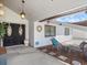Relaxing covered porch with seating area and decorative elements near the front door at 8305 Palma Vista Ln, Tampa, FL 33614