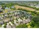 Expansive aerial view of a well-planned community with natural ponds and lush green spaces at 838 Vino Verde Cir, Brandon, FL 33511