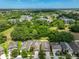 Aerial view of home in a lushly landscaped neighborhood with tree coverage at 838 Vino Verde Cir, Brandon, FL 33511