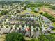 Scenic aerial view of a vibrant residential community featuring lush greenery and serene ponds at 838 Vino Verde Cir, Brandon, FL 33511