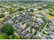 Aerial view showcasing a home near a pond in a residential neighborhood at 838 Vino Verde Cir, Brandon, FL 33511