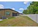 Spacious backyard with mature landscaping, privacy fence, and screened patio at 838 Vino Verde Cir, Brandon, FL 33511