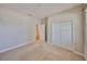 A bright bedroom with neutral carpet and a double-door closet at 838 Vino Verde Cir, Brandon, FL 33511