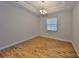 Bright dining room with hardwood floors, tray ceiling, and modern chandelier at 838 Vino Verde Cir, Brandon, FL 33511