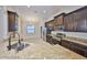 Beautiful kitchen featuring granite countertops, stainless appliances, and dark wood cabinets at 838 Vino Verde Cir, Brandon, FL 33511