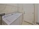 Laundry room with appliances, shelving, and tile flooring at 838 Vino Verde Cir, Brandon, FL 33511