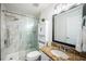 Bathroom featuring glass enclosed shower and granite counters at 8800 Bay Pines Blvd # 303, St Petersburg, FL 33709