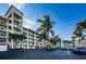 An exterior elevation of Boca Ciega shows the complex's architectural design and parking at 8800 Bay Pines Blvd # 303, St Petersburg, FL 33709