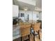 Kitchen with stainless appliances and granite counters with seating at the breakfast bar at 8800 Bay Pines Blvd # 303, St Petersburg, FL 33709
