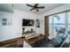 Cozy living room with comfortable seating and scenic views from the sliding glass doors to the patio at 8800 Bay Pines Blvd # 303, St Petersburg, FL 33709