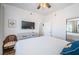 Relaxing main bedroom with ceiling fan and decorative touches at 8800 Bay Pines Blvd # 303, St Petersburg, FL 33709