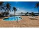 Community pool overlooking the Bay with brick pavers and beautiful views at 8800 Bay Pines Blvd # 303, St Petersburg, FL 33709