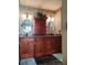 Bathroom featuring double vanity sinks with cabinetry and decorative mirrors at 8810 41St N St, Pinellas Park, FL 33782